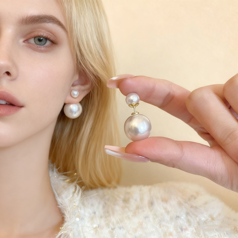 A pair of pearl and silver needle earrings for women in Europe and America, with a niche, simple, versatile style. The earrings